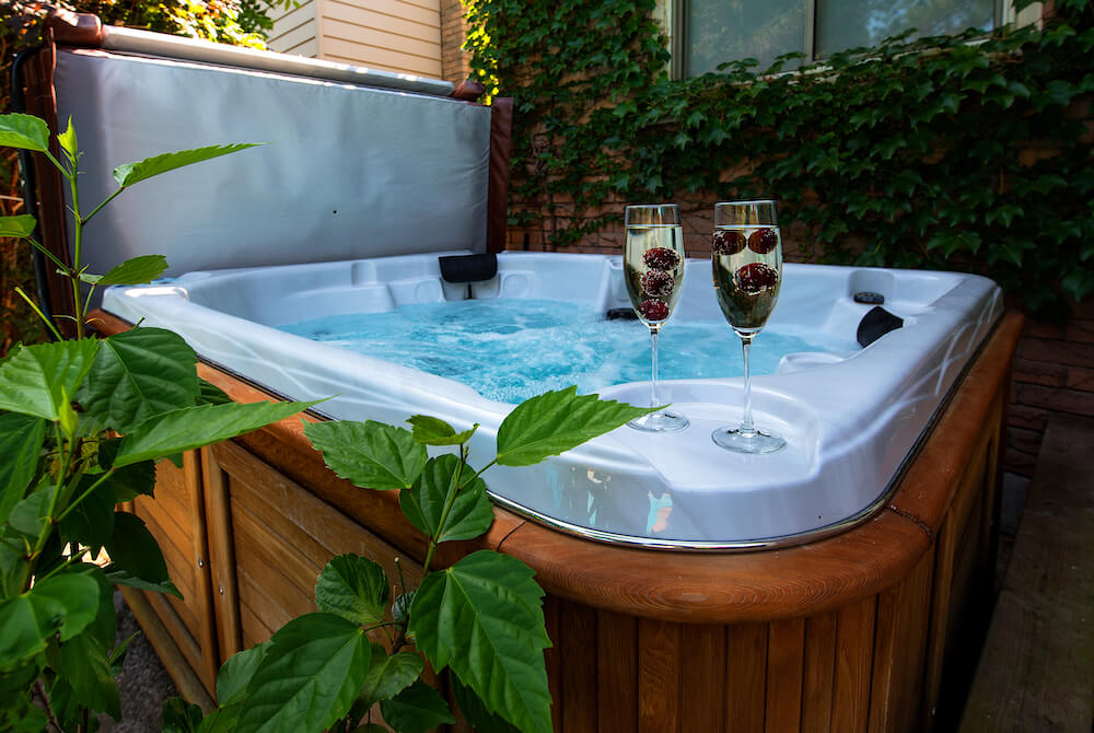 Property with outdoor hot tub hot tub with champagne